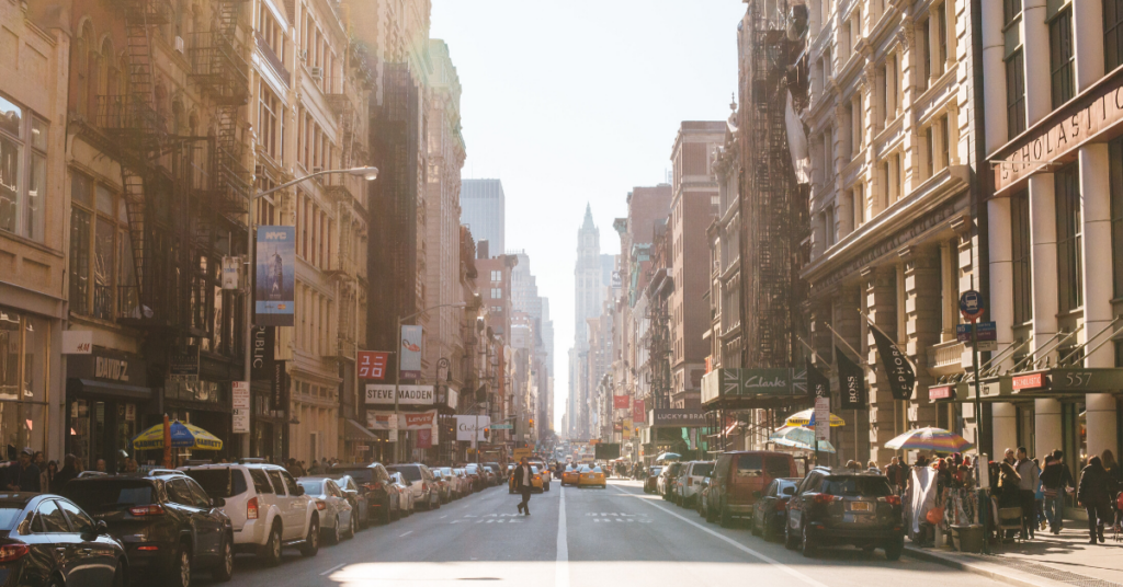 Bustling street of people and businesses, in New York City.